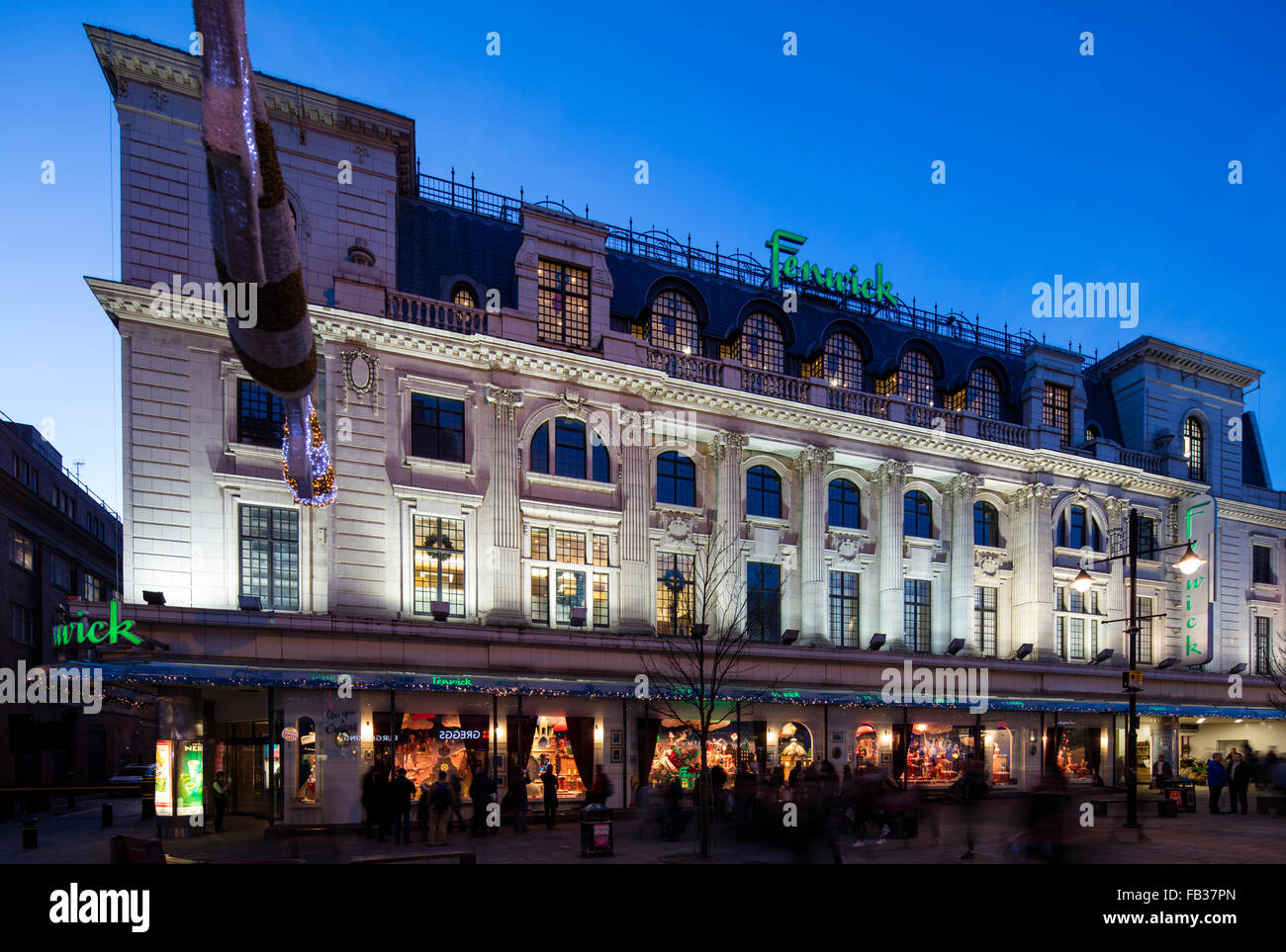 A view at dusk of the Christmas window display in Fenwick Ltd on Northumberland Street in Newcastle upon Tyne Stock Photo