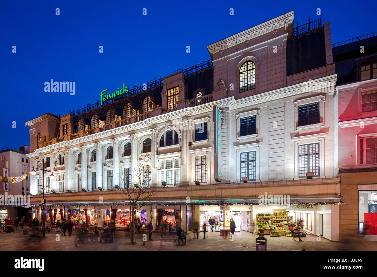 A view at dusk of the Christmas window display in Fenwick Ltd on Northumberland Street in Newcastle upon Tyne Stock Photo