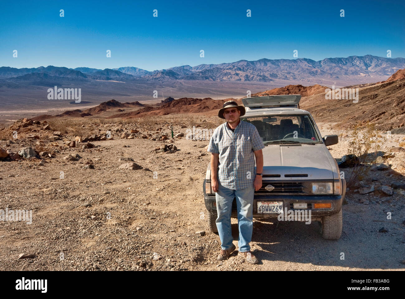 Traveler at Ashford Mine Road, Black Mountains, Death Valley in dist, Mojave Desert, Death Valley National Park, California, USA Stock Photo