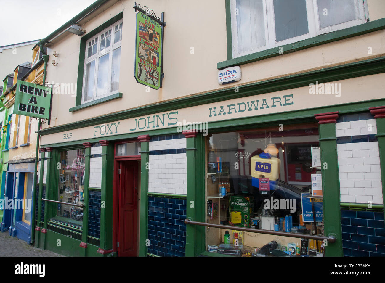 Foxy John's Bar, Hardware and Bicycles Sign; Dingle; Ireland Stock Photo