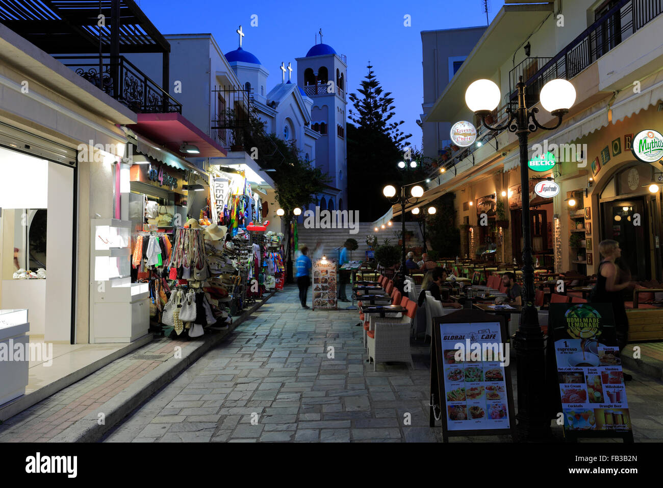 People shopping at night, Kos town, Kos Island, Dodecanese group of islands, South Aegean Sea, Greece. Stock Photo