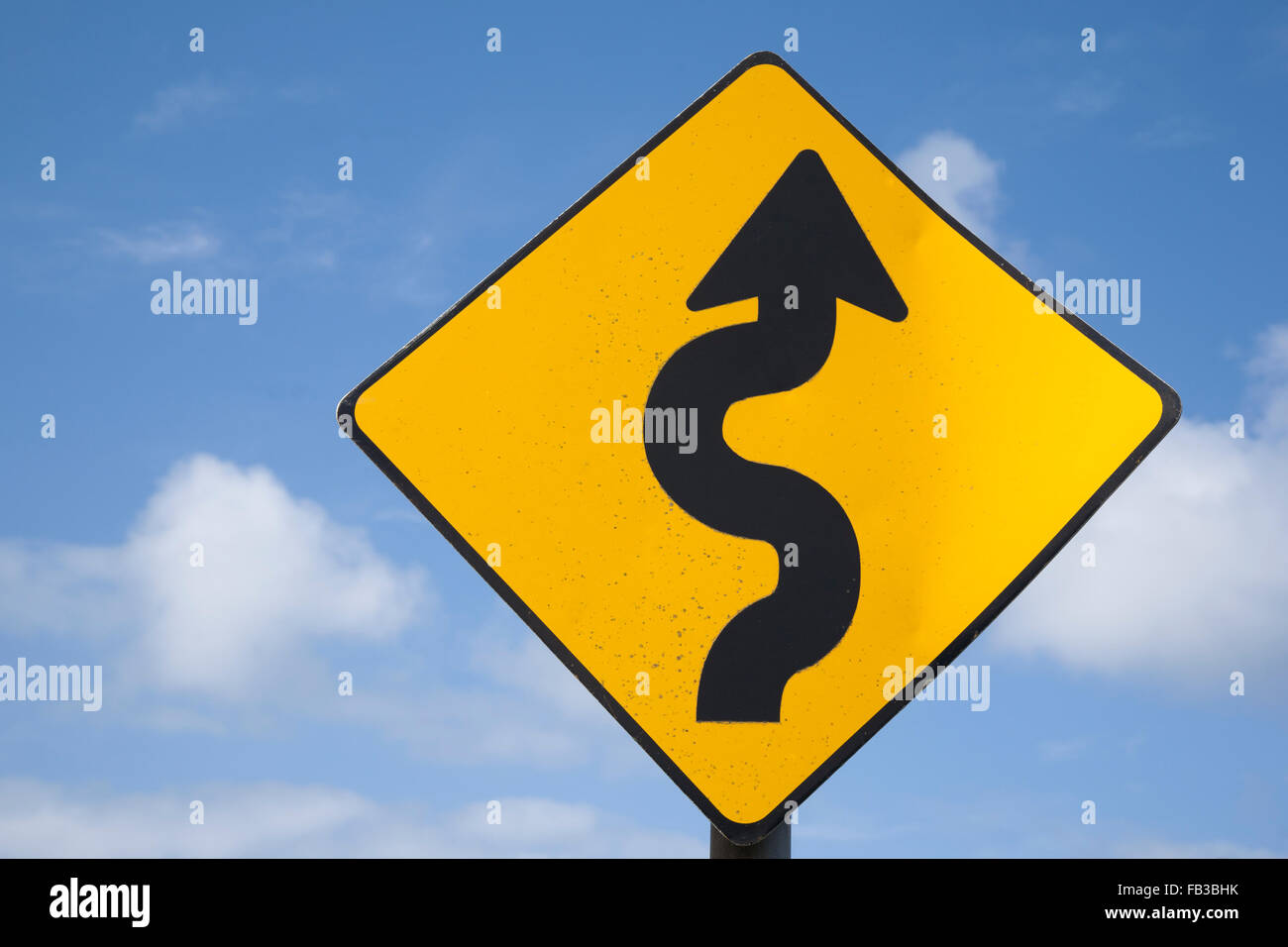 Curve Road Traffic Warning Sign in Village Setting Stock Photo - Alamy