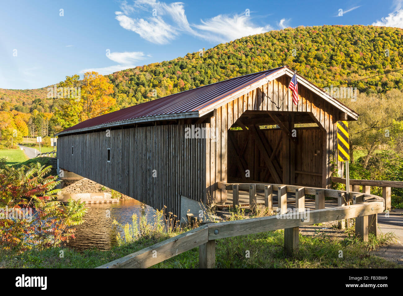 Hamden Covered Bridge set against a colorful Autumn hillside in the Catskills Mountains on New