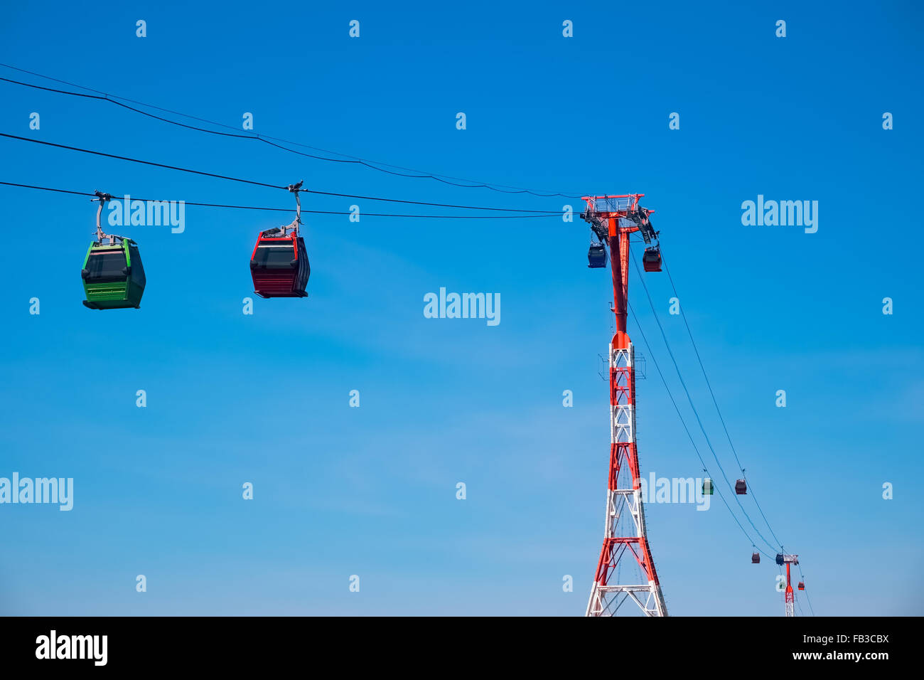 Cableway with cabins on blue sky background, Vinpearl Amusement Park, Nha Trang, Vietnam Stock Photo