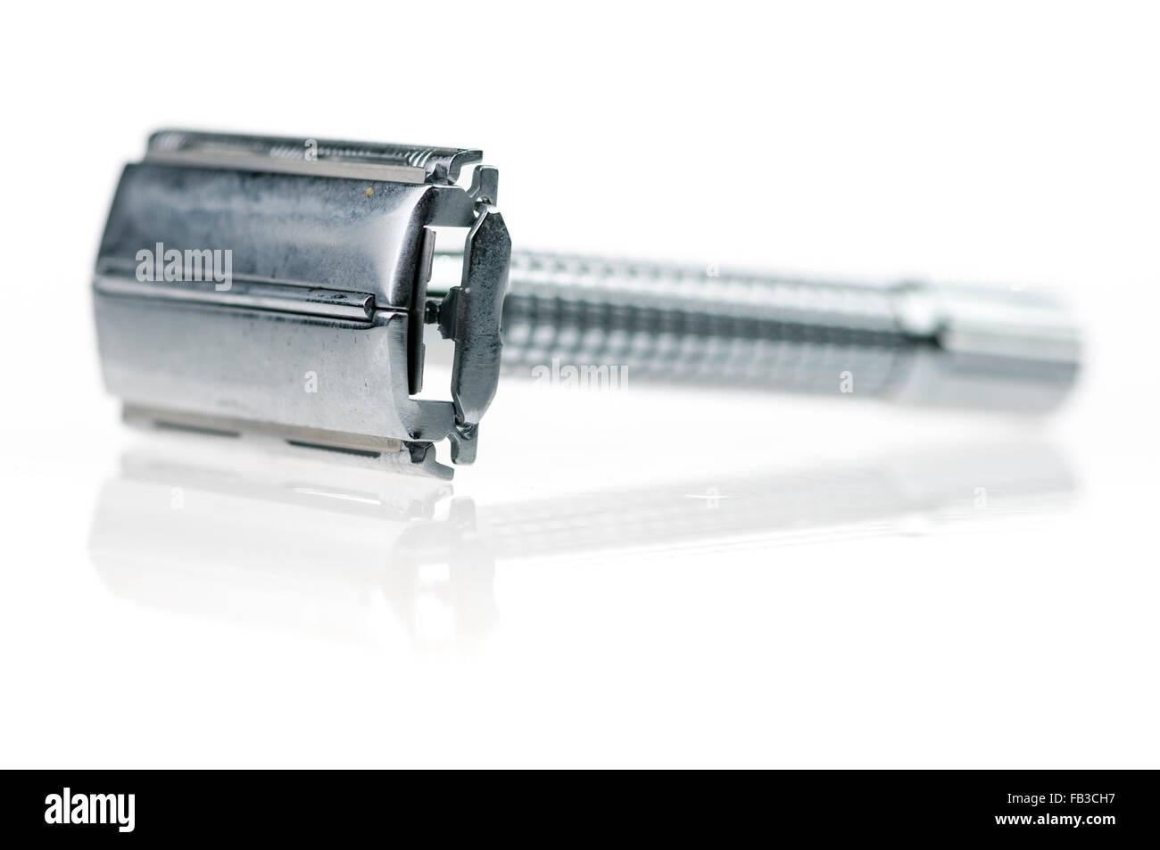 Old fashioned stainless steel safety razor. Stock Photo