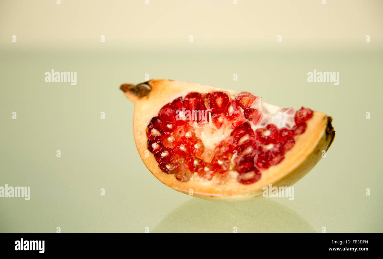 Slice of pomegranate Stock Photo - Alamy