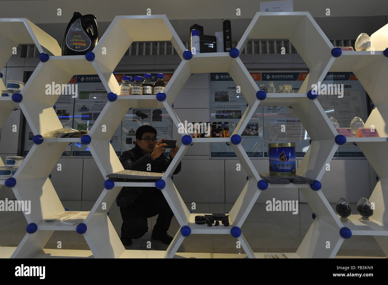 Tangshan, China's Hebei Province. 8th Jan, 2016. A visitor takes photo of the graphene products at an exhibition hall of Tangshan Jianhua Industrial Group in Tangshan, north China's Hebei Province, Jan. 8, 2016. The 100-ton graphene production line has been on stream for one year. © Zheng Yong/Xinhua/Alamy Live News Stock Photo