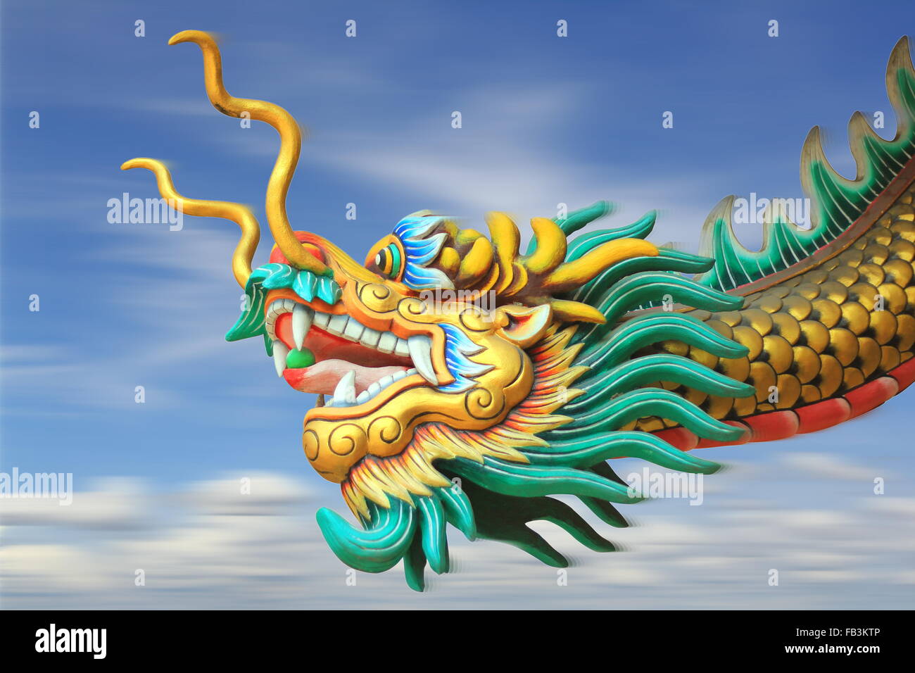conceptual art : motion blur effect of china dragon statue fast forward movement in the sky Stock Photo