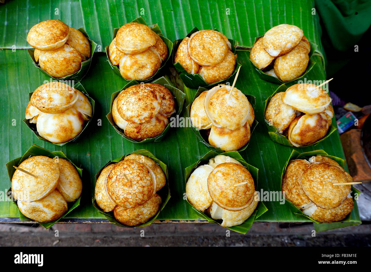 Sweet and Savory Grilled Coconut-Rice Hotcakes, Coconut Rice Cake, Asian dessert, Thai, Thailand, Luang Prabang, Laos Stock Photo