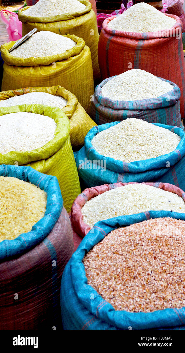 Rice in colorful sack at fresh local market  in Luang Prabang, Laos Stock Photo