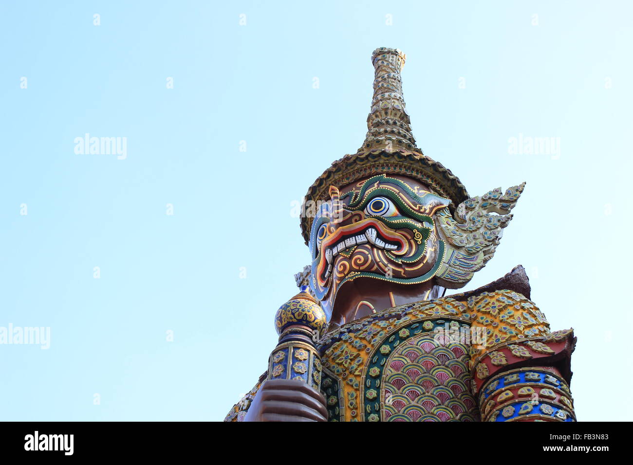 Background of Giant Statue at The Emerald Buddha Temple Stock Photo