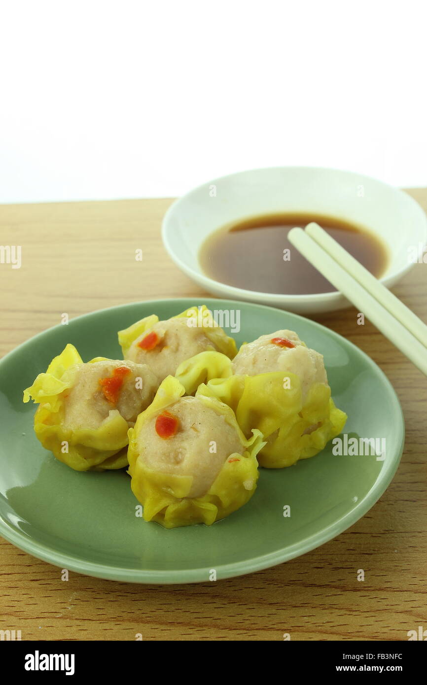 shumai , siu mai - chinese steamed pork dumplings with sauce Stock Photo