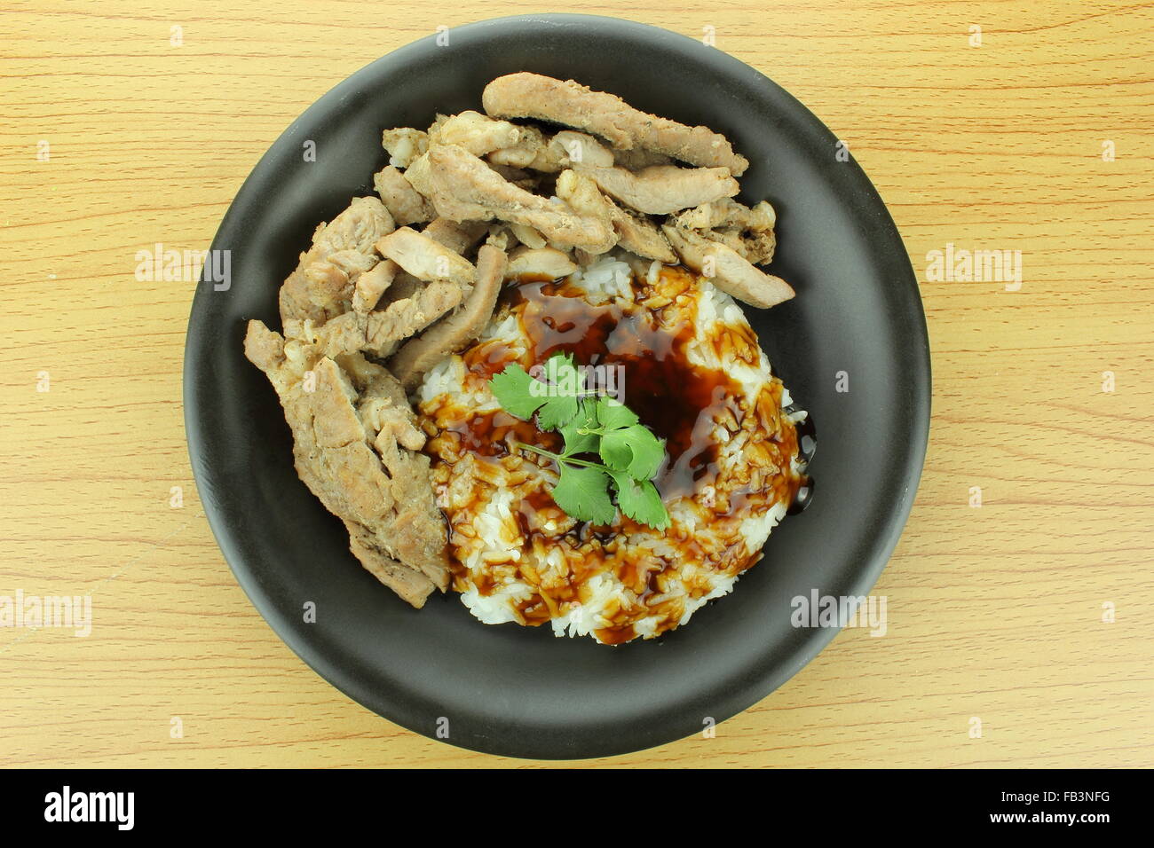 background of pork steak with rice and teriyaki sauce Stock Photo
