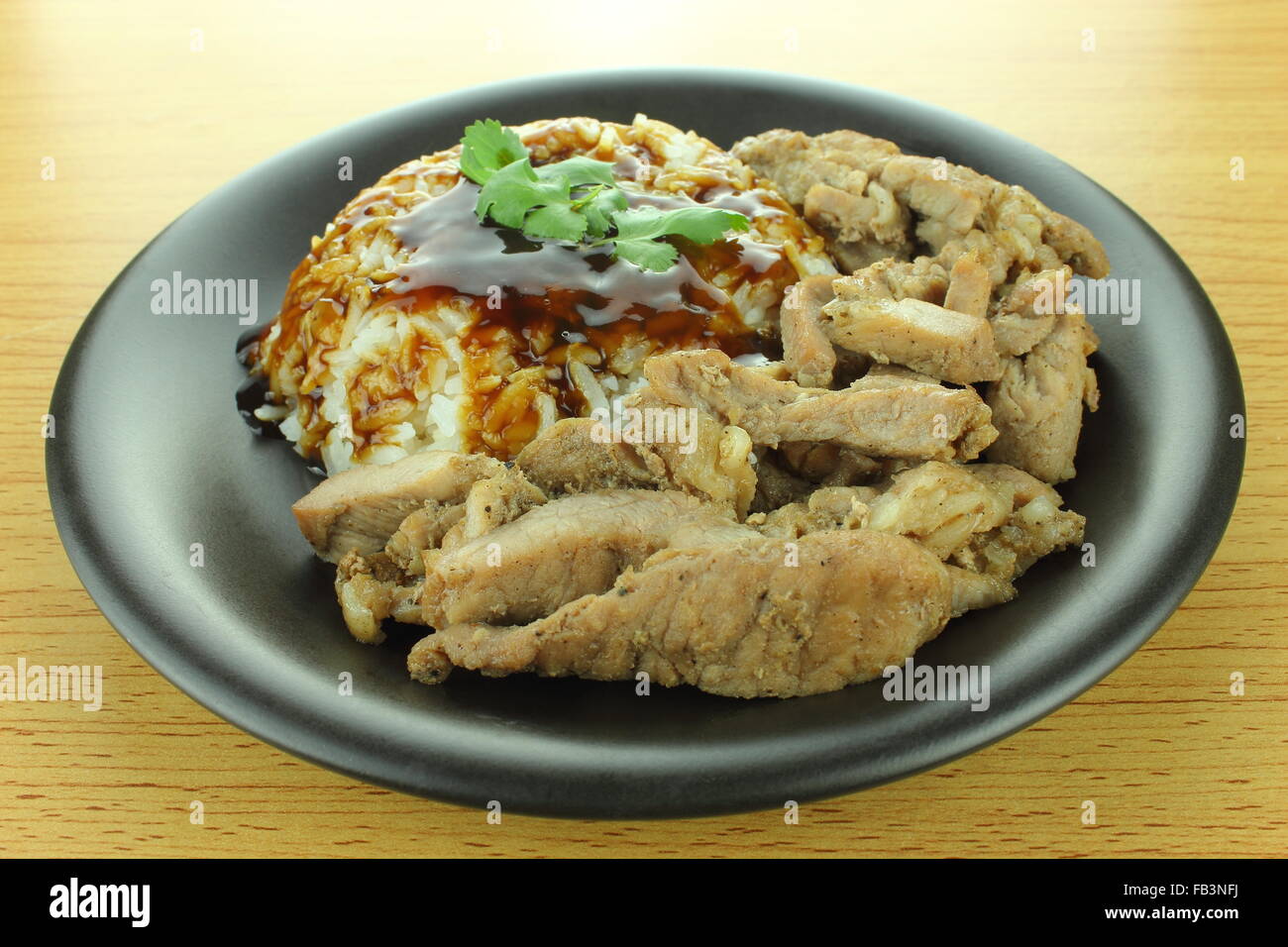 background of pork steak with rice and teriyaki sauce Stock Photo