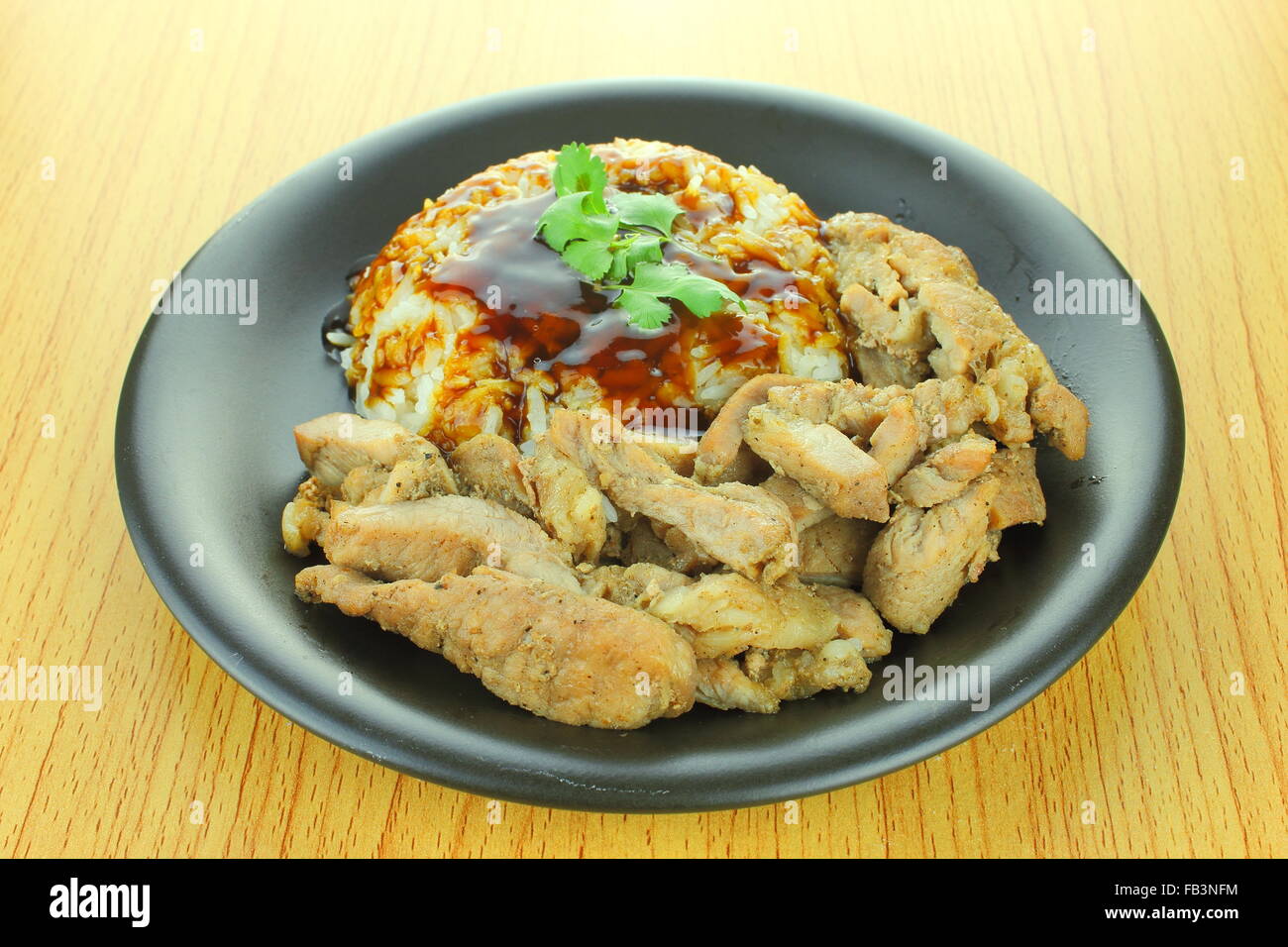 background of pork steak with rice and teriyaki sauce Stock Photo