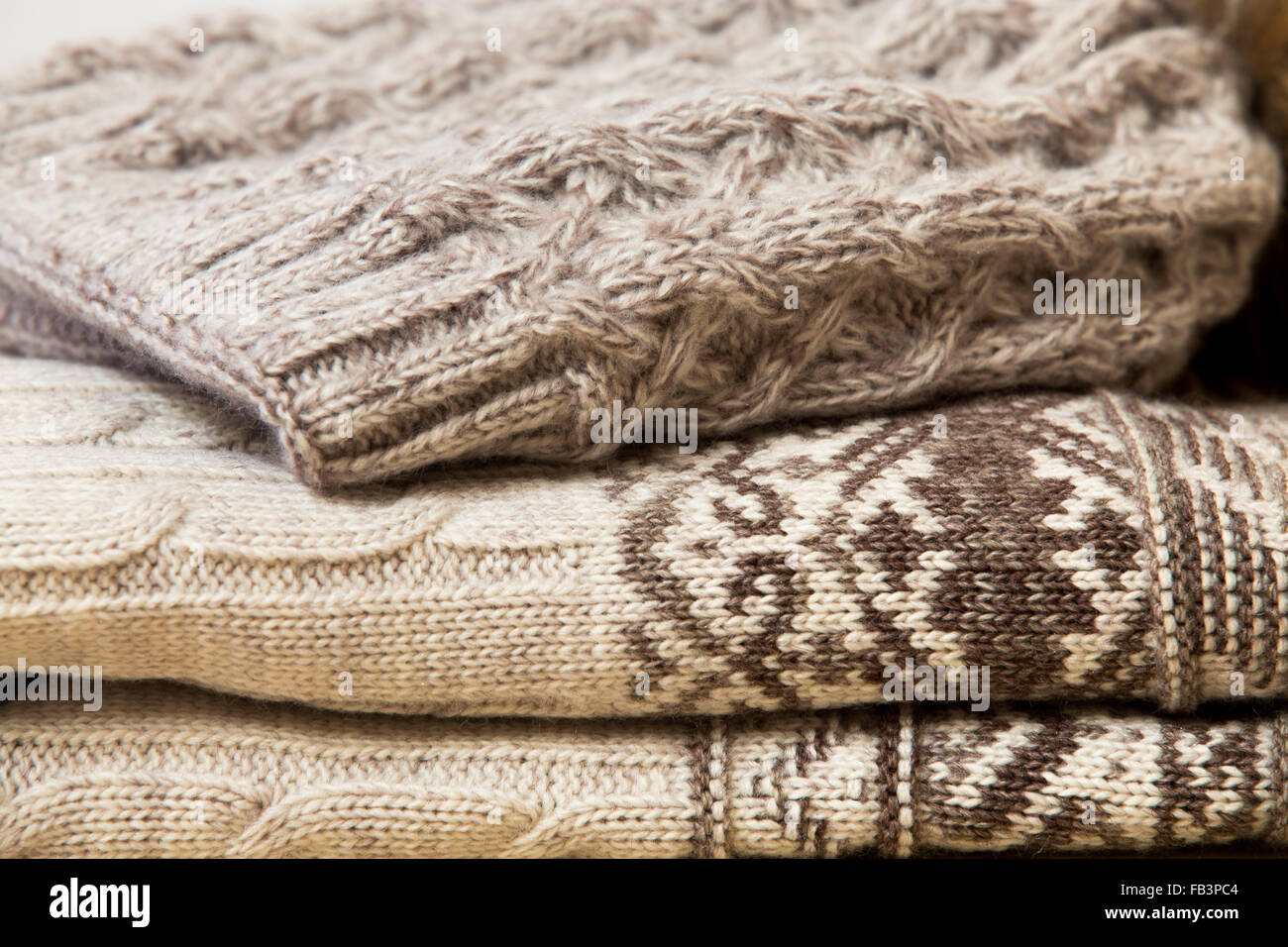 Close up of folded woolen clothes in beige Stock Photo