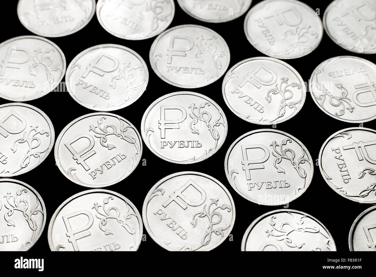 Metal Russian ruble coins on black background Stock Photo