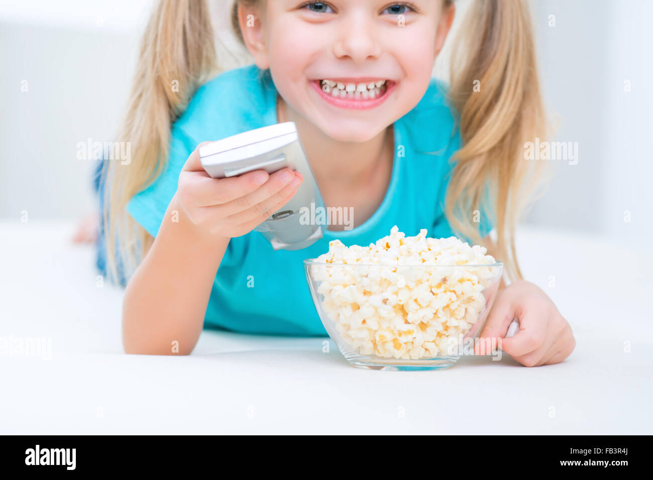 Cute girl watching TV Stock Photo