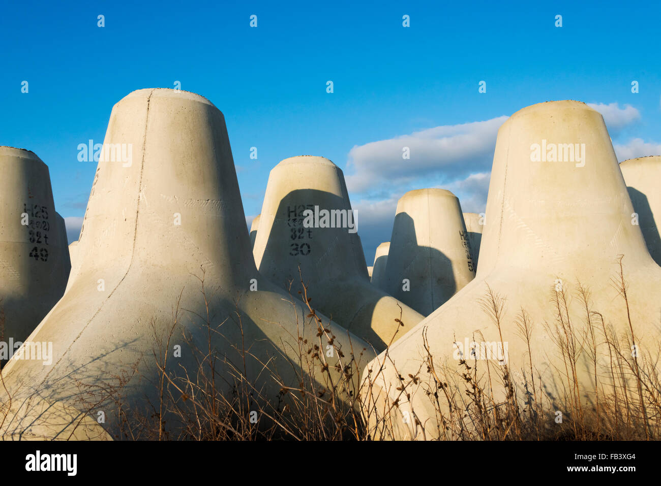 Concrete blocks to be dropped along the coast for tsunami protection, Wajima, Noto Peninsula, Ishikawa Prefecture, Japan Stock Photo