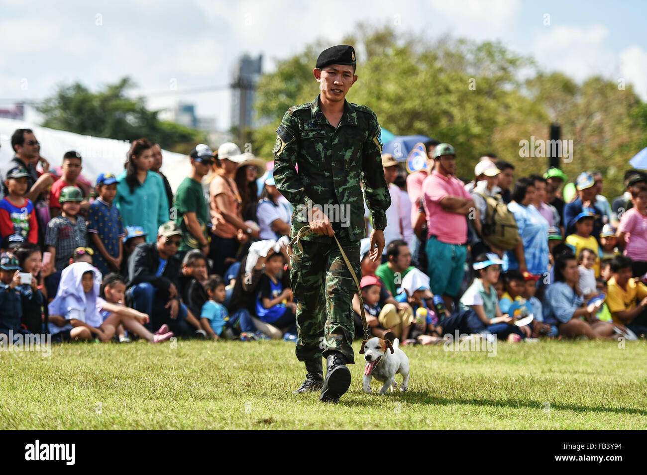 (160109) -- BANGKOK, Jan. 9. 2016 (Xinhua) -- A soldier and his army dog participate in a performance during a public opening event marking the Thai Children' s Day at the Royal Thai Army 2nd Cavalry Division based in the north of downtown Bangkok, Thailand, Jan. 9, 2016. Thailand opened a number of its military bases to the public while the Thai Children' s Day is observed on the second Saturday in January. (Xinhua/Li Mangmang) Stock Photo