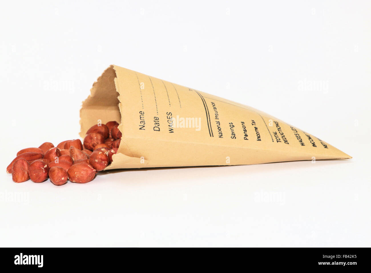 Wage packet containing peanuts Stock Photo