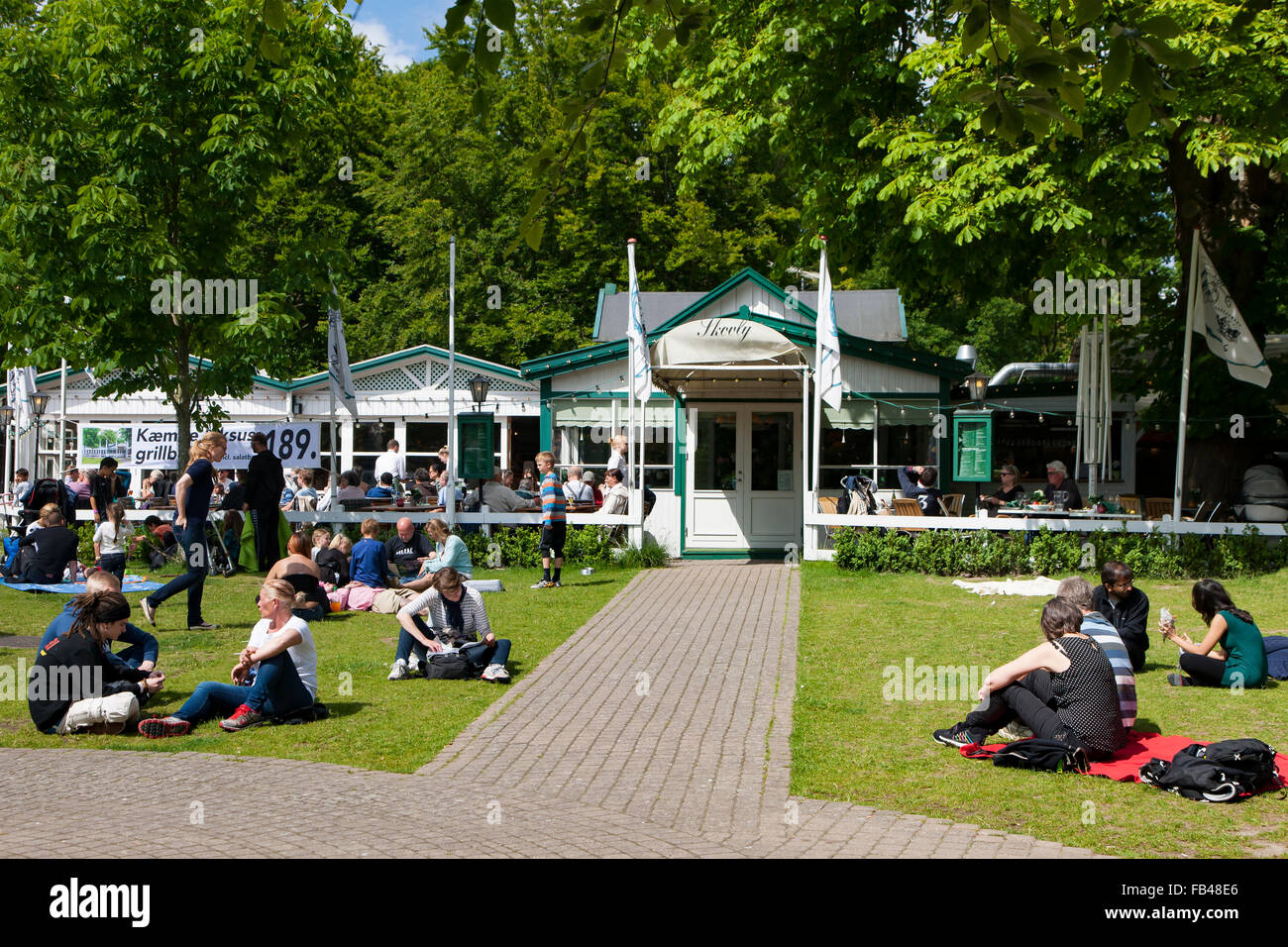The relaxing lawn area at the amusement park Bakken, Klampenborg, Copenhagen, Denmark Stock Photo