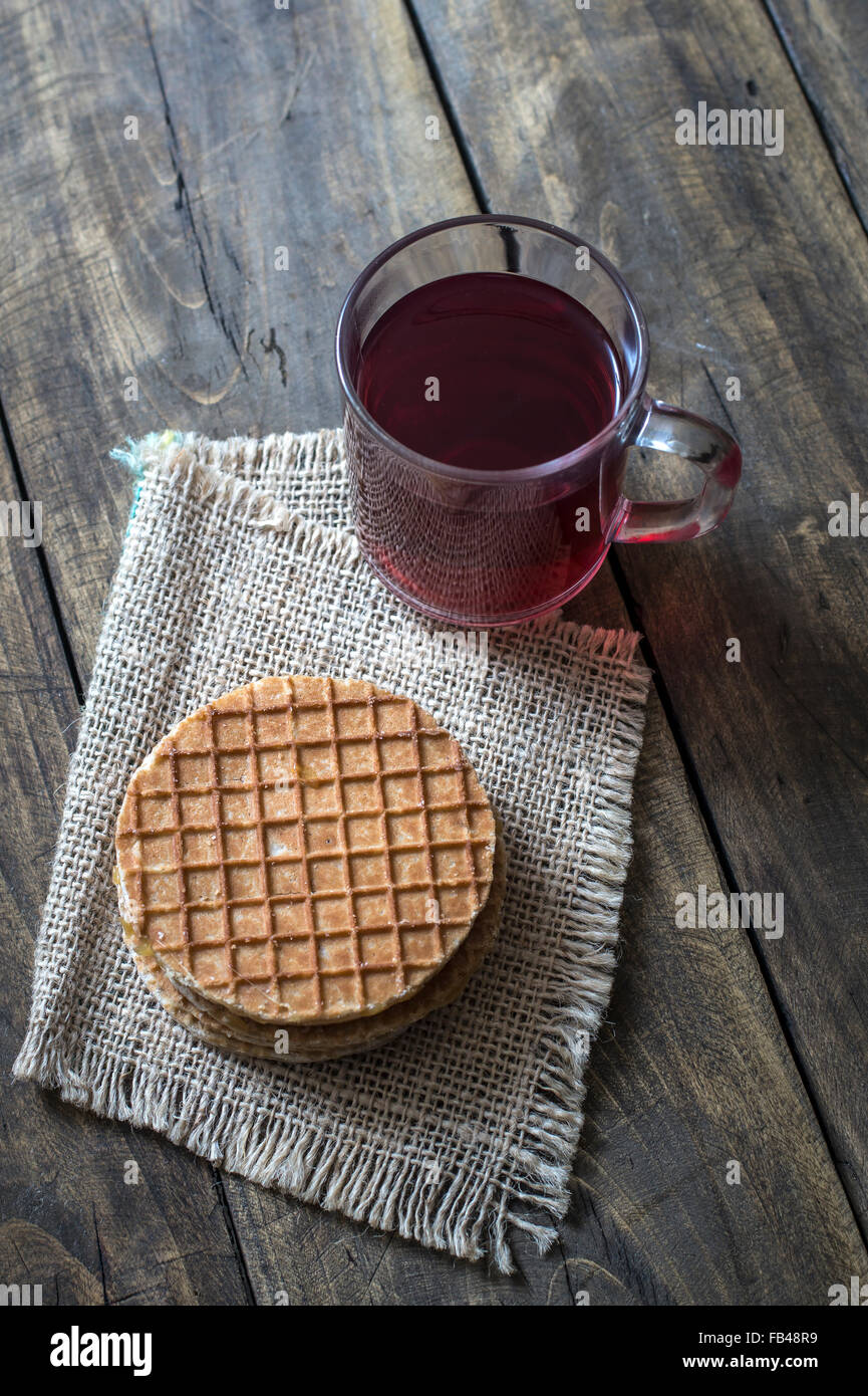 dutch waffles  with caramel and tea  on wooden background Stock Photo