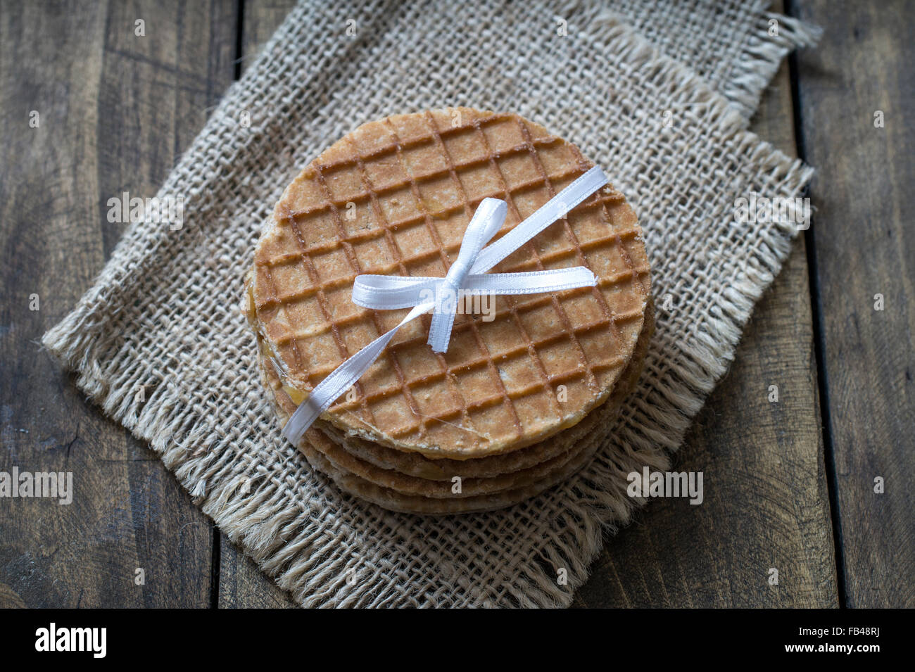 dutch waffles with caramel on wooden background, close up Stock Photo