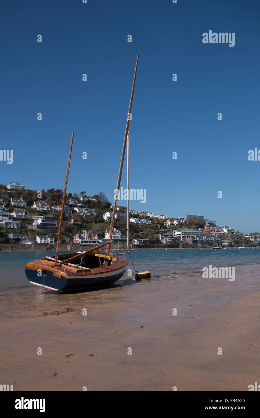 A yacht moored up on Mill Bay overlooking Salcombe Estuary on a Summers Day in Devon Stock Photo