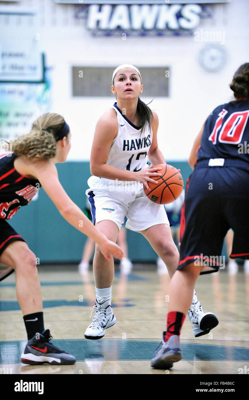 Female basketball player shooting hires stock photography and images