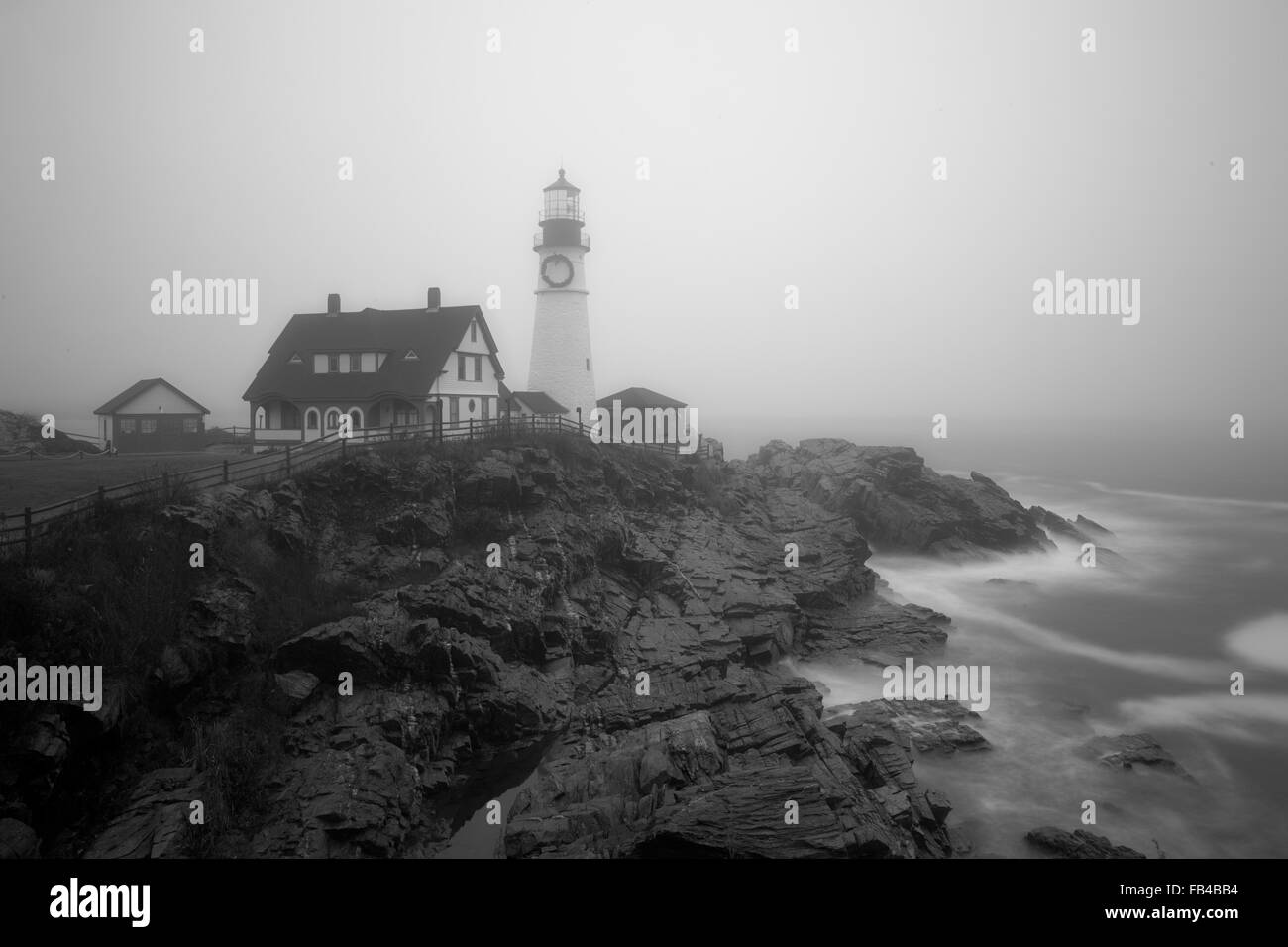 South side of Portland Head lighthouse, Cape Elizabeth, Maine on a foggy morning. Stock Photo