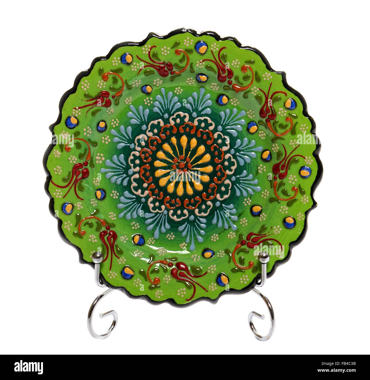 Decorative ceramic plate of hand made trademark 'Faros Keramik' with Floral Design, green Stock Photo
