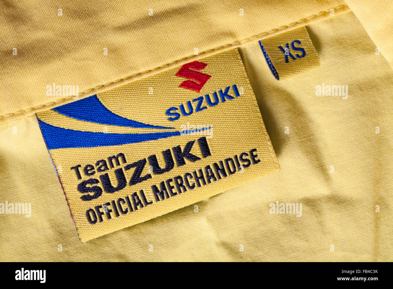 label in Team Suzuki Official Merchandise yellow shirt Stock Photo