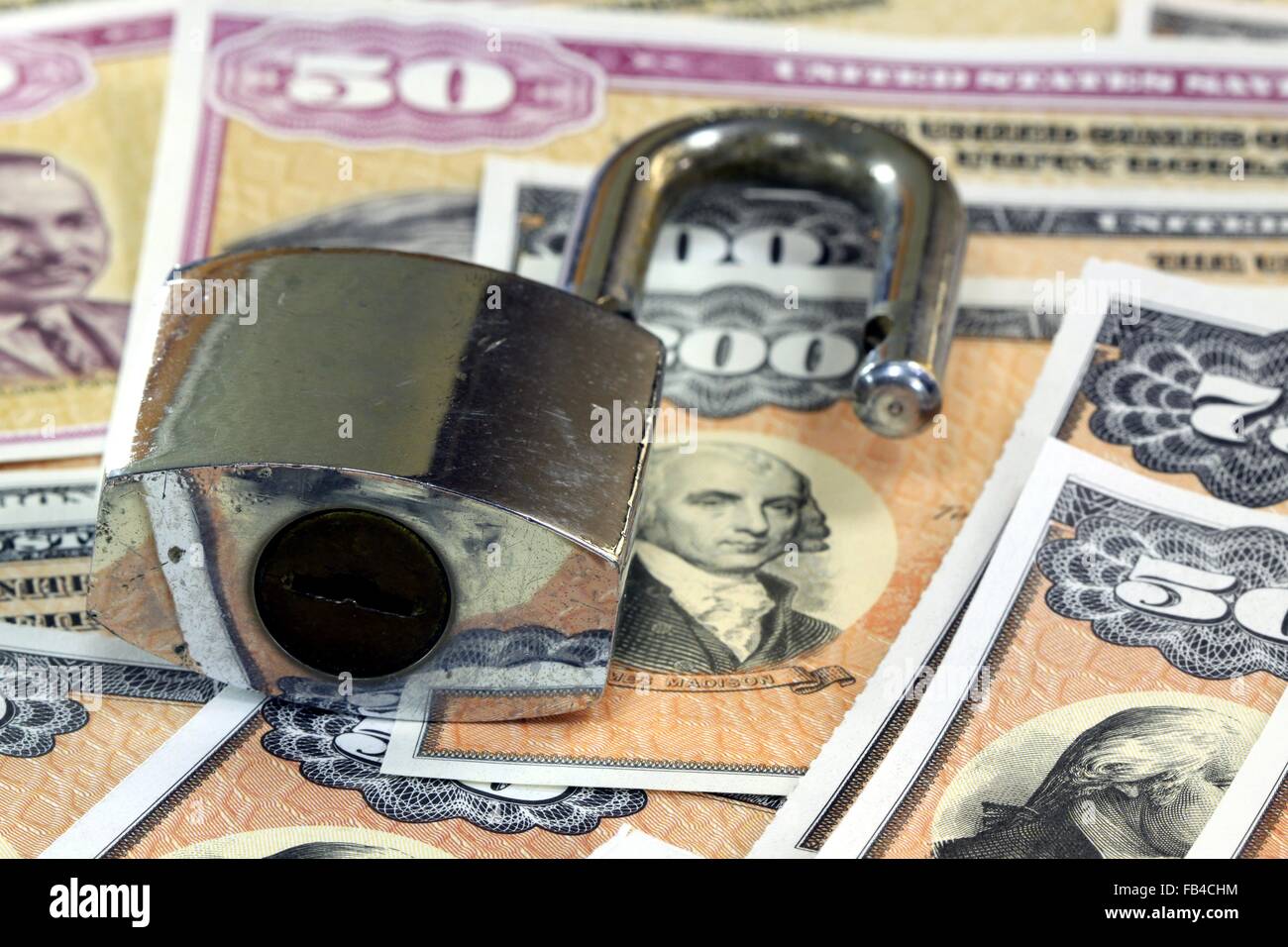 United States Savings Bonds with padlock - Financial security concept Stock Photo