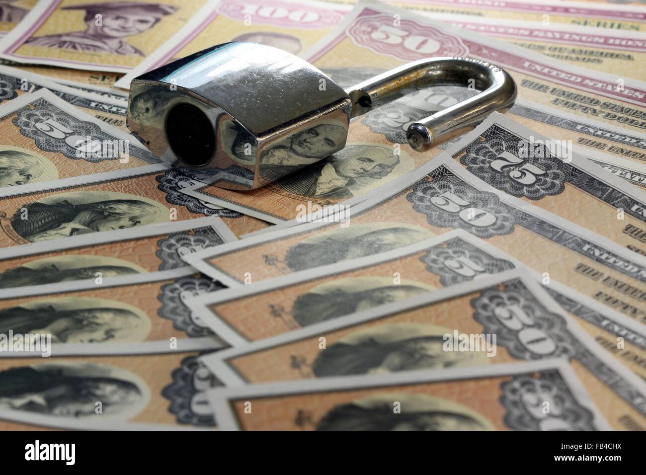 United States Savings Bonds with padlock - Financial security concept Stock Photo