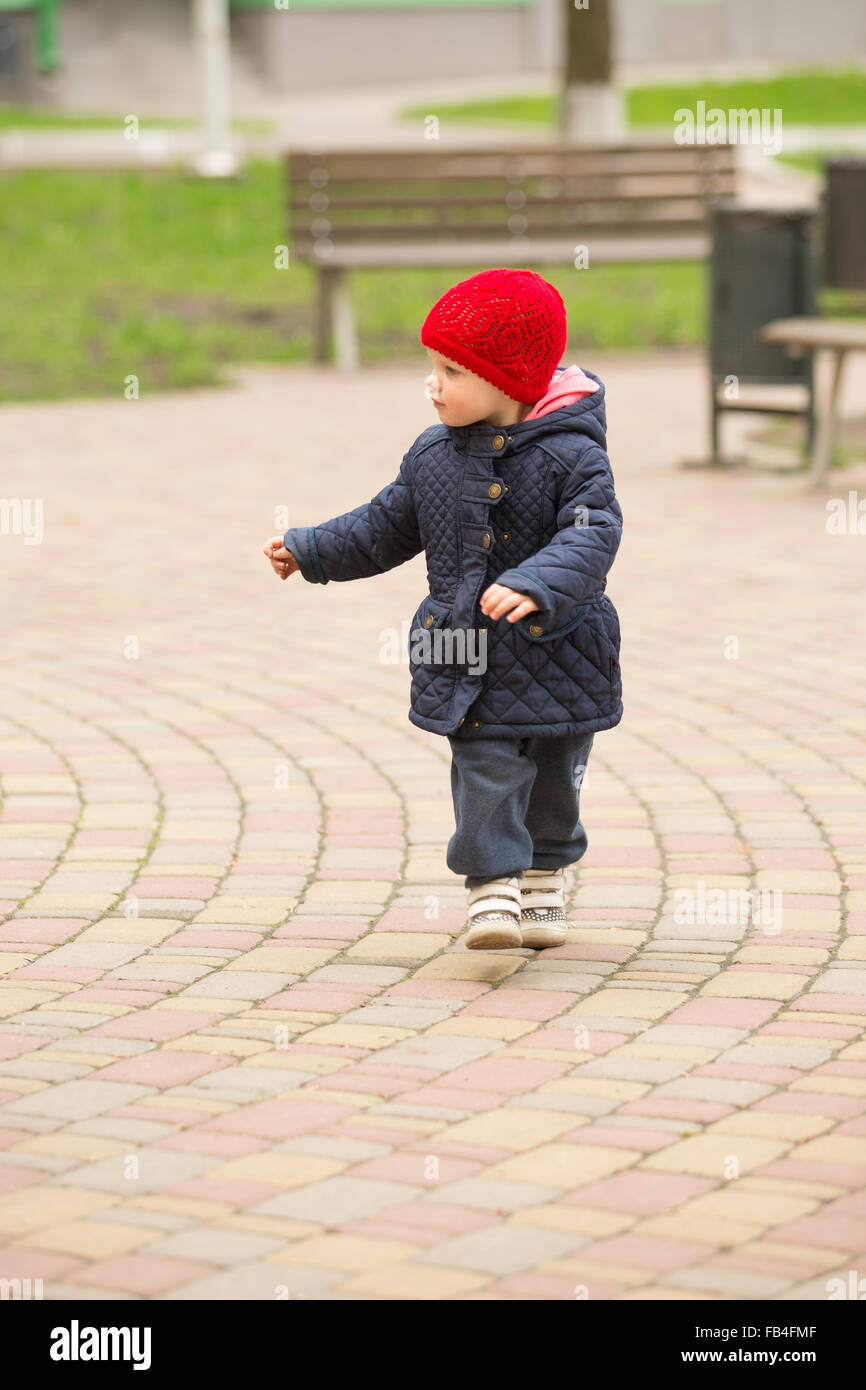 cute little girl playing in the park in spring Stock Photo - Alamy