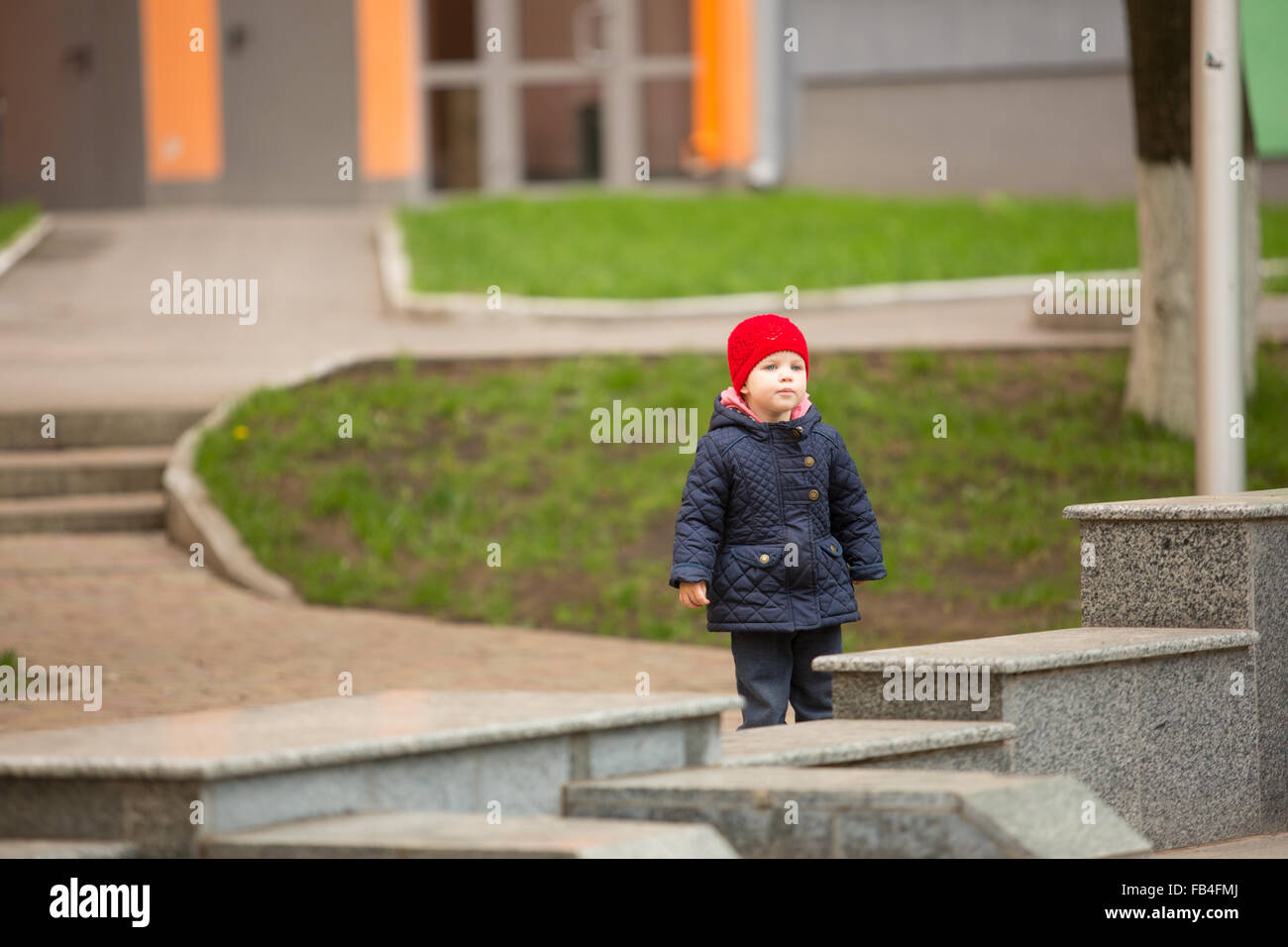 cute little girl playing in the park in spring Stock Photo - Alamy