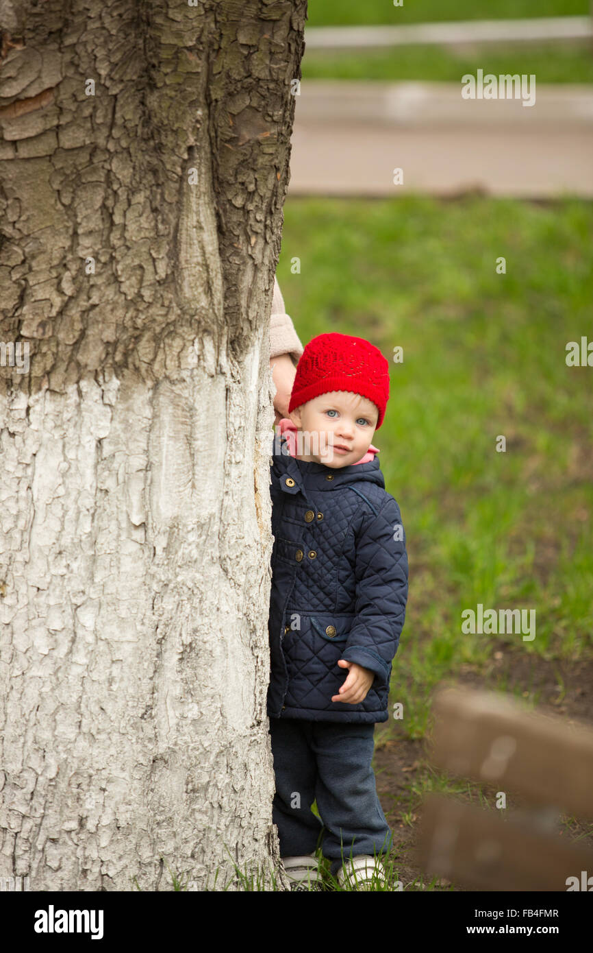 cute little girl playing in the park in spring Stock Photo - Alamy