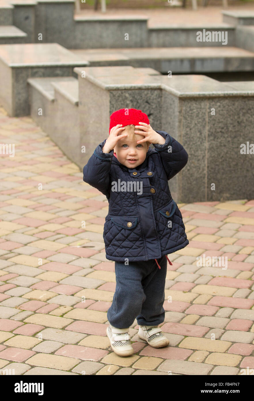 cute little girl playing in the park in spring Stock Photo - Alamy