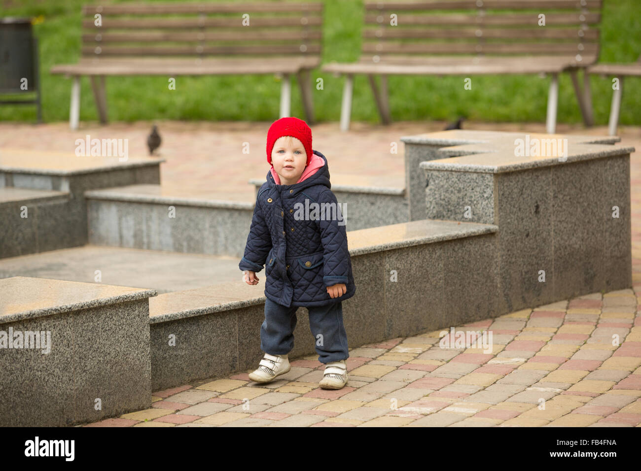 cute little girl playing in the park in spring Stock Photo - Alamy