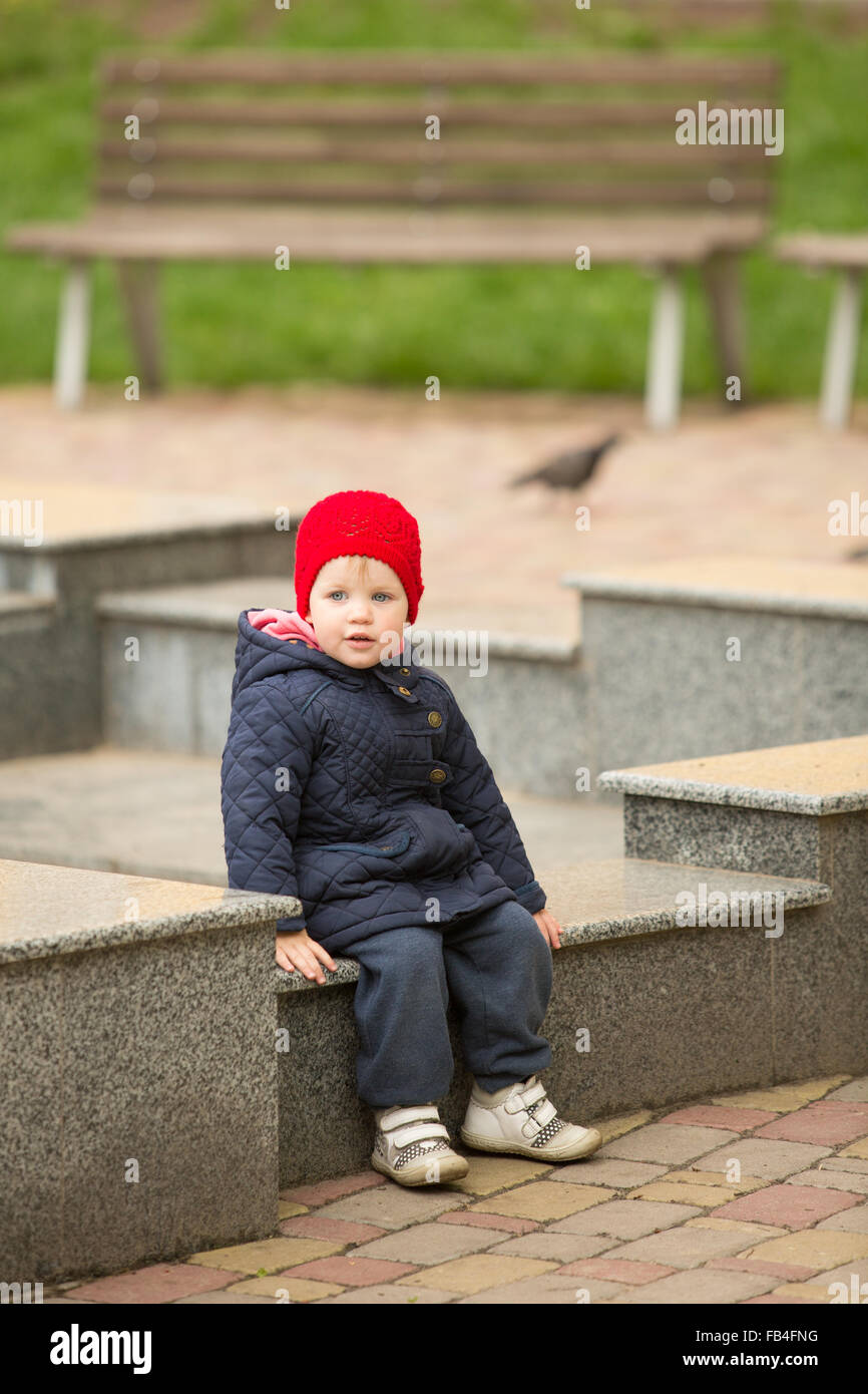 cute little girl playing in the park in spring Stock Photo - Alamy