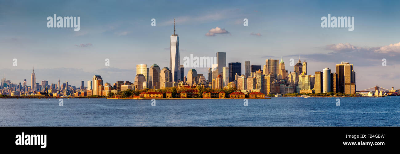 Panoramic of Lower Manhattan Financial District and New York skyscrapers. From Brooklyn Bridge to Midtown West and Ellis Island Stock Photo