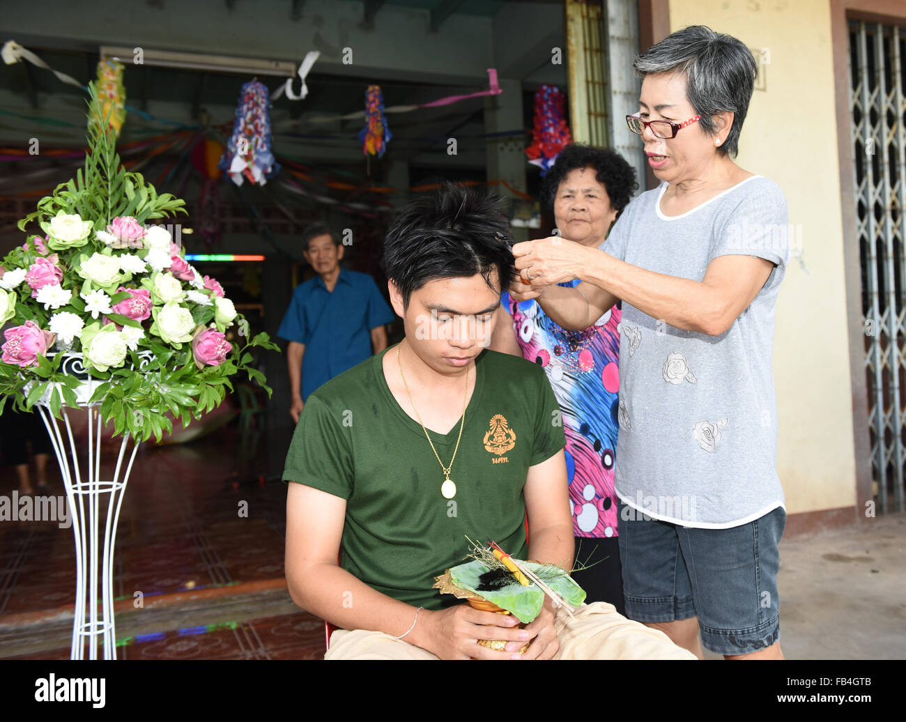 Nakhonnayok-Thailand ,July 3 : Shaved ordained Buddhist ceremony in Thailand. Thai man gets his head shaved JULY 3 , 2015 Stock Photo