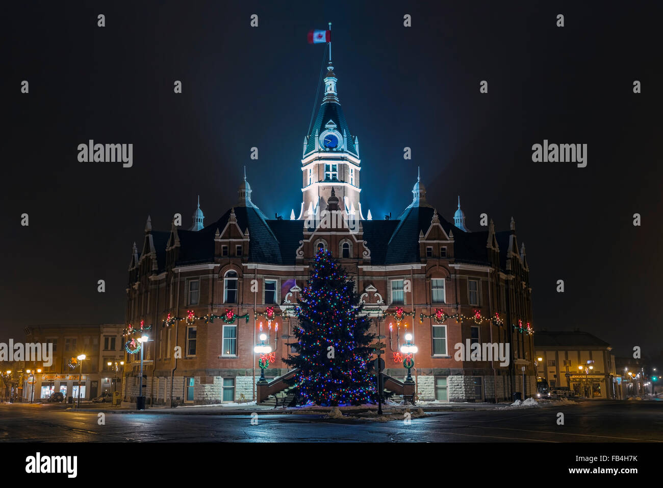 Stratford City Hall at night illuminated by Christmas decorations with