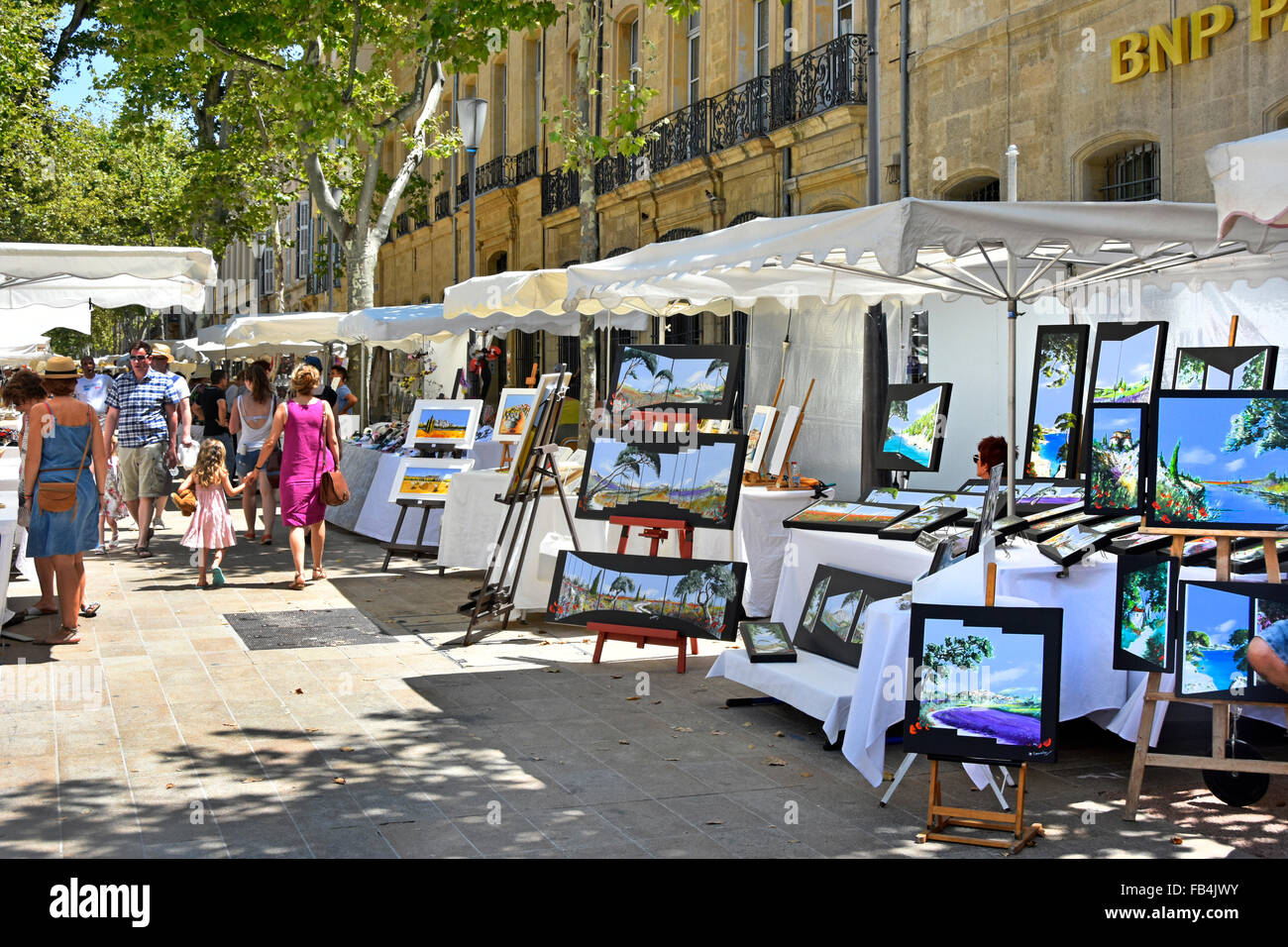 Aix en Provence France Sunday all white French street market stalls & canopies along tree lined Cours Mirabeau on hot summers day in Provence France Stock Photo