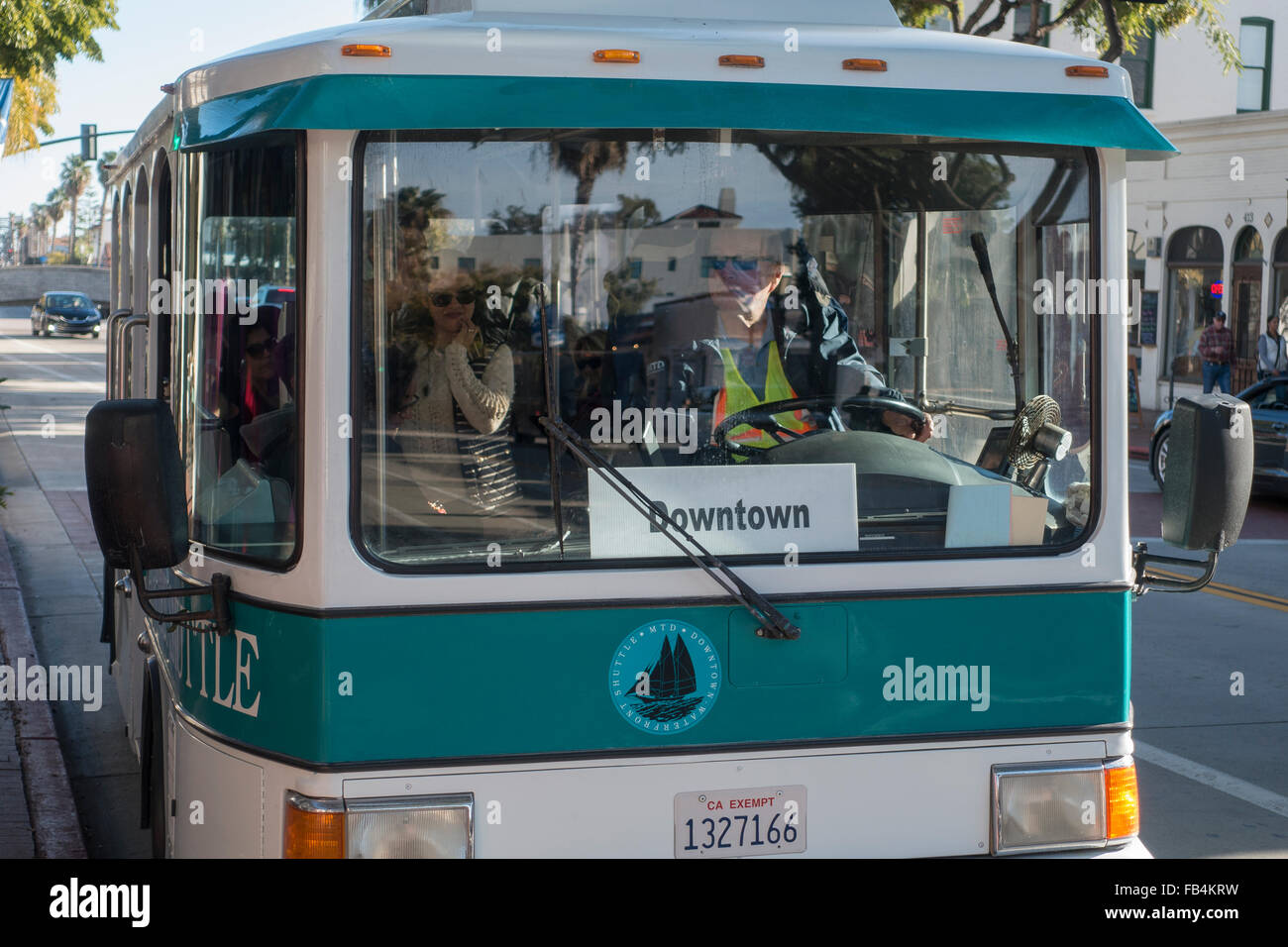 The Santa Barbara Downtown Shuttle. It is a small electric bus that runs up and down State Street, the city's main street. Stock Photo