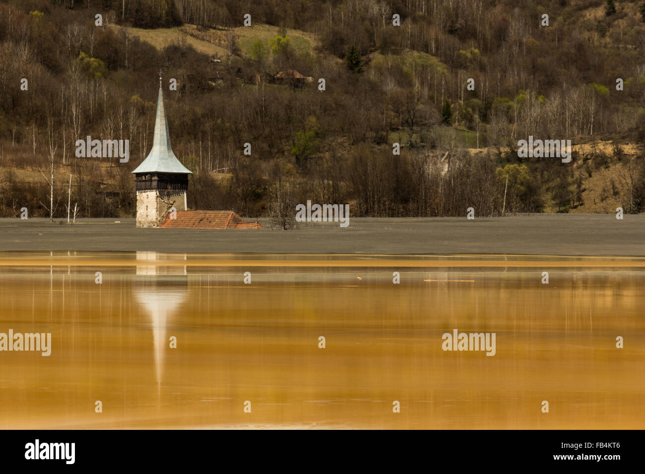 Church engulfed in the copper contaminated Geamana lake Stock Photo