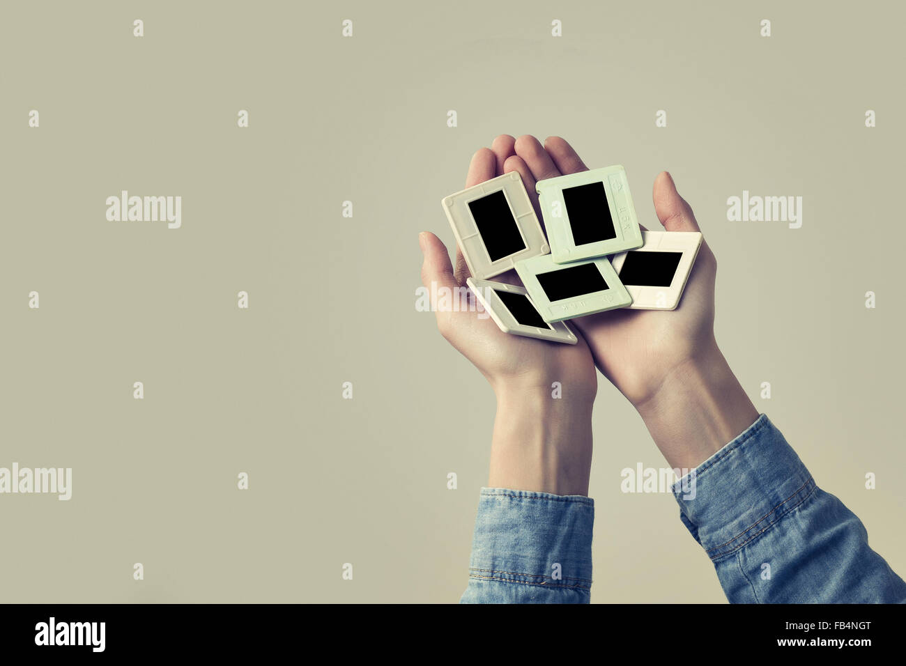 female hand holding old Photo slides frame. vintage look Stock Photo