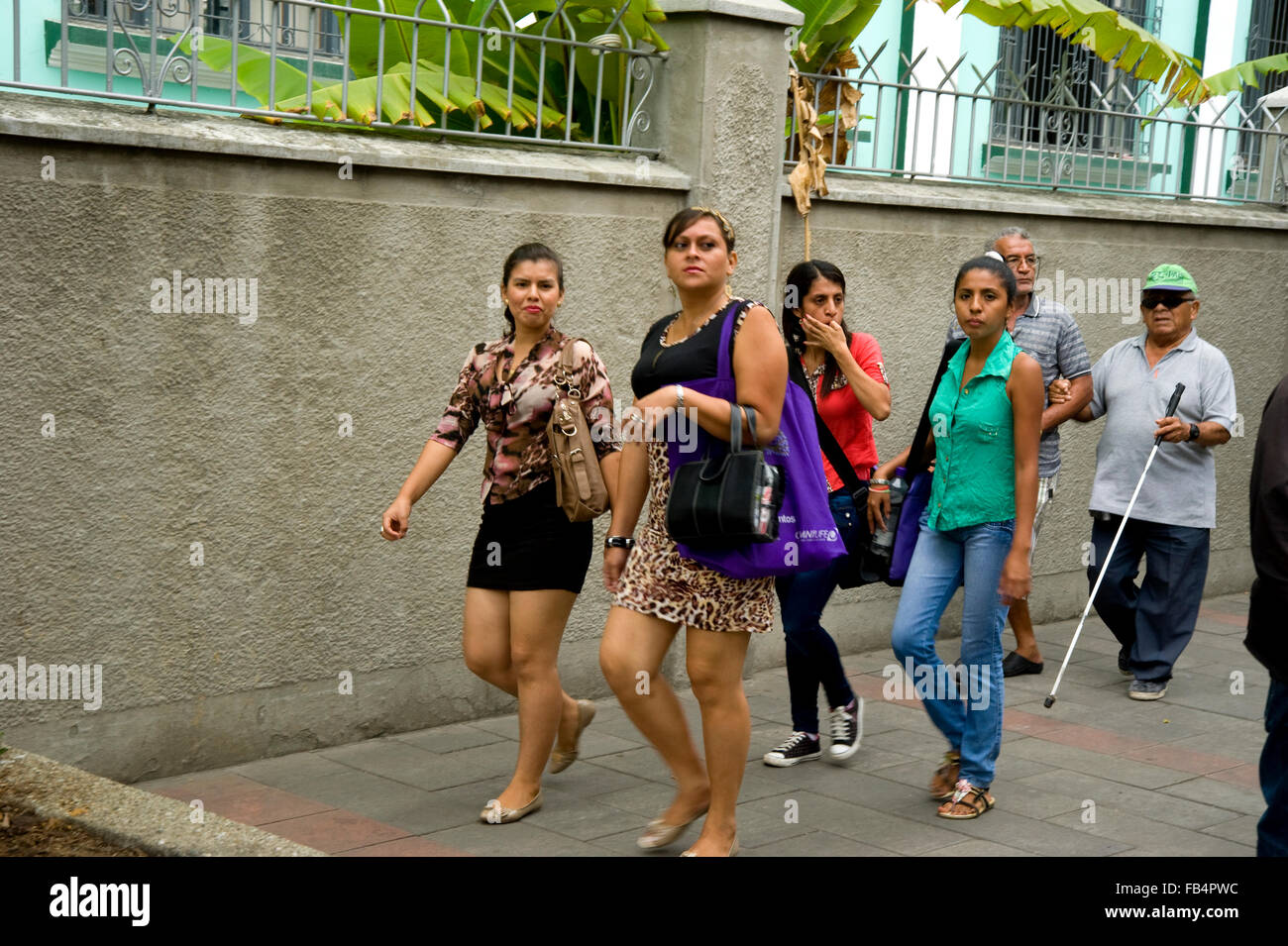 Ecuadoran people walking on the street in Guayaquil Stock Photo