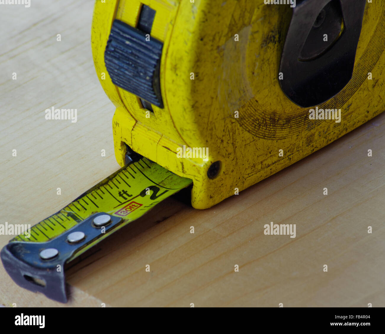 Trusty tape measure is standard tool of the carpenter Stock Photo Alamy